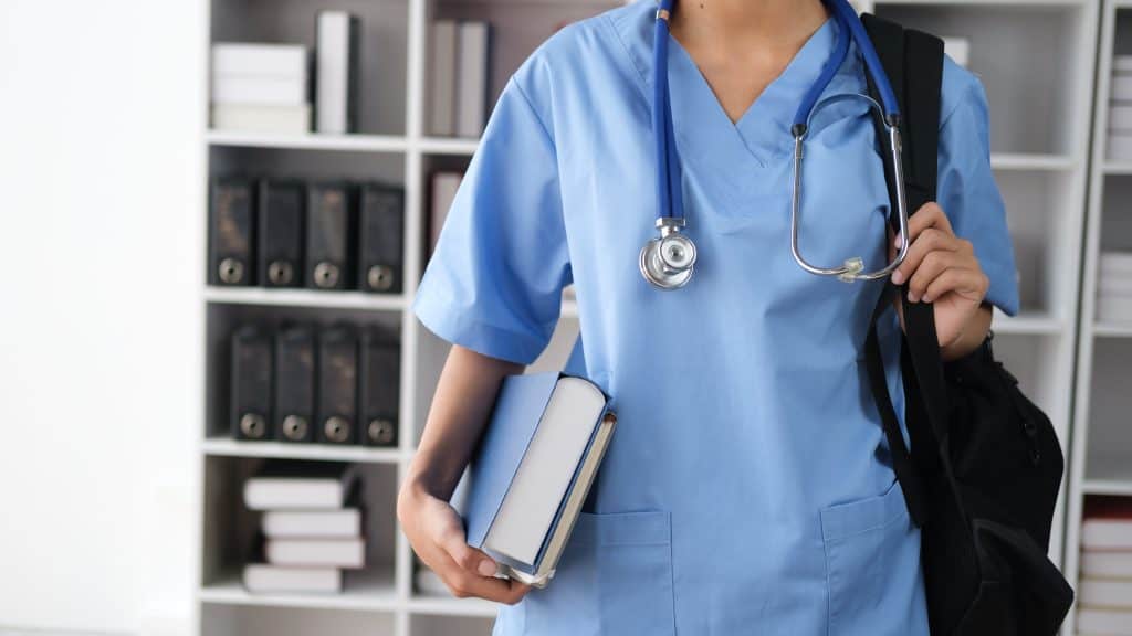 Close up view of nursing student standing in the study room.