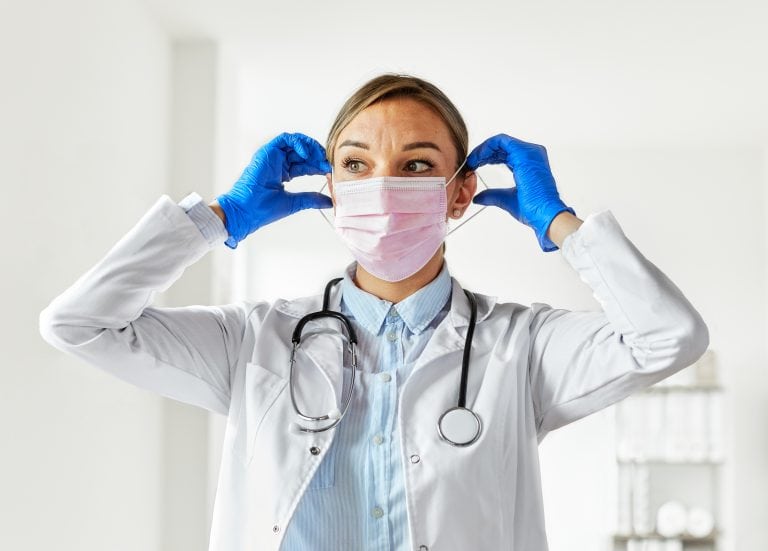 doctor medical mask wearing hospital coronavirus health virus woman nurse pandemic care medicine portrait glove